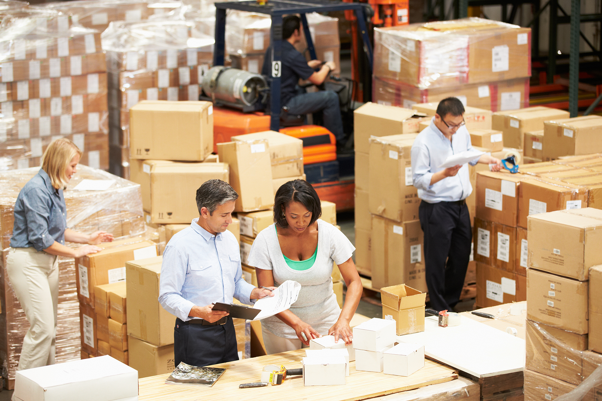 Workers In Warehouse Preparing Goods For Dispatch Workers In Warehouse Preparing Goods For Dispatch